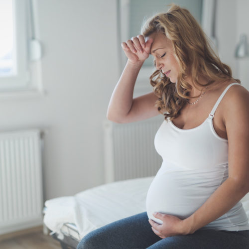 pregnant-woman-suffering-with-headache-wellnest