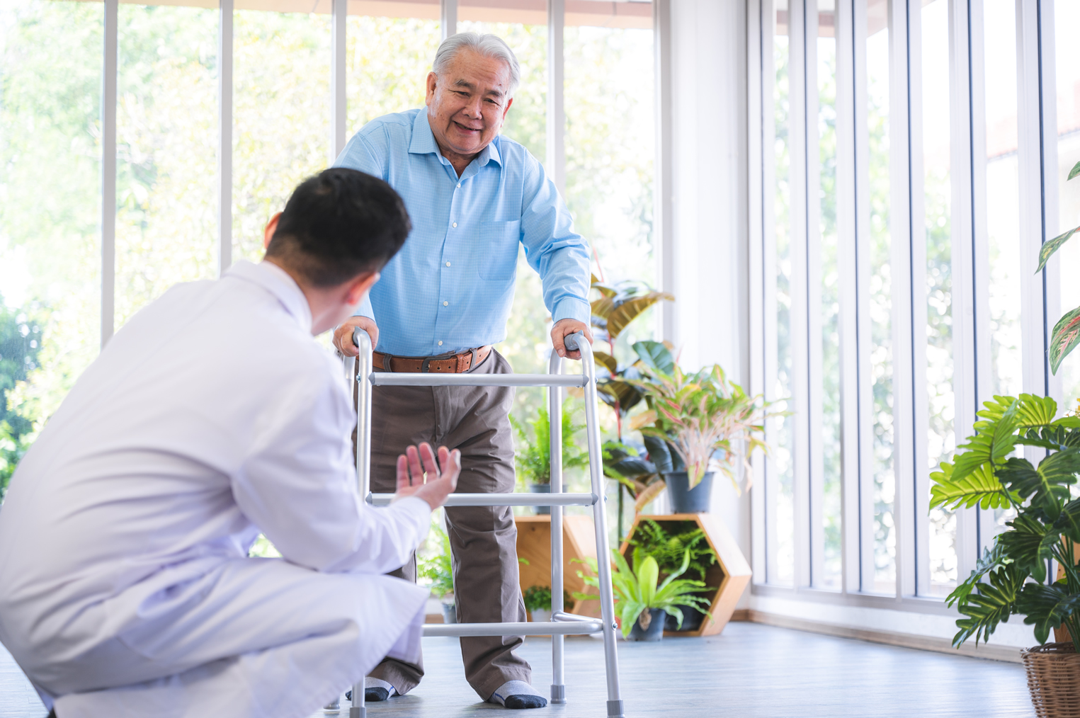 orthopedic-doctor-and-senior-patient-with-walker-a-wellnest